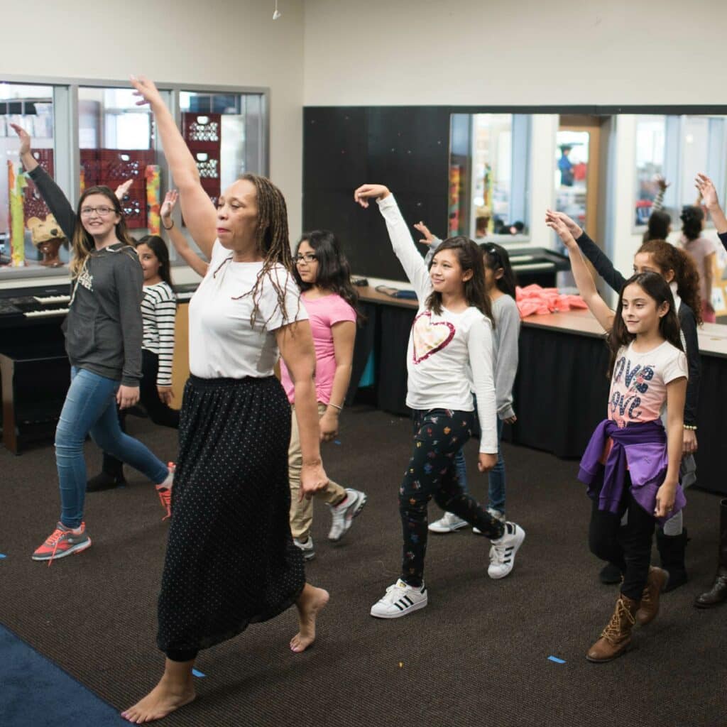 Students are led in a dance routine